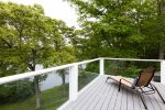 Brand new deck with views of the pond and outdoor furniture